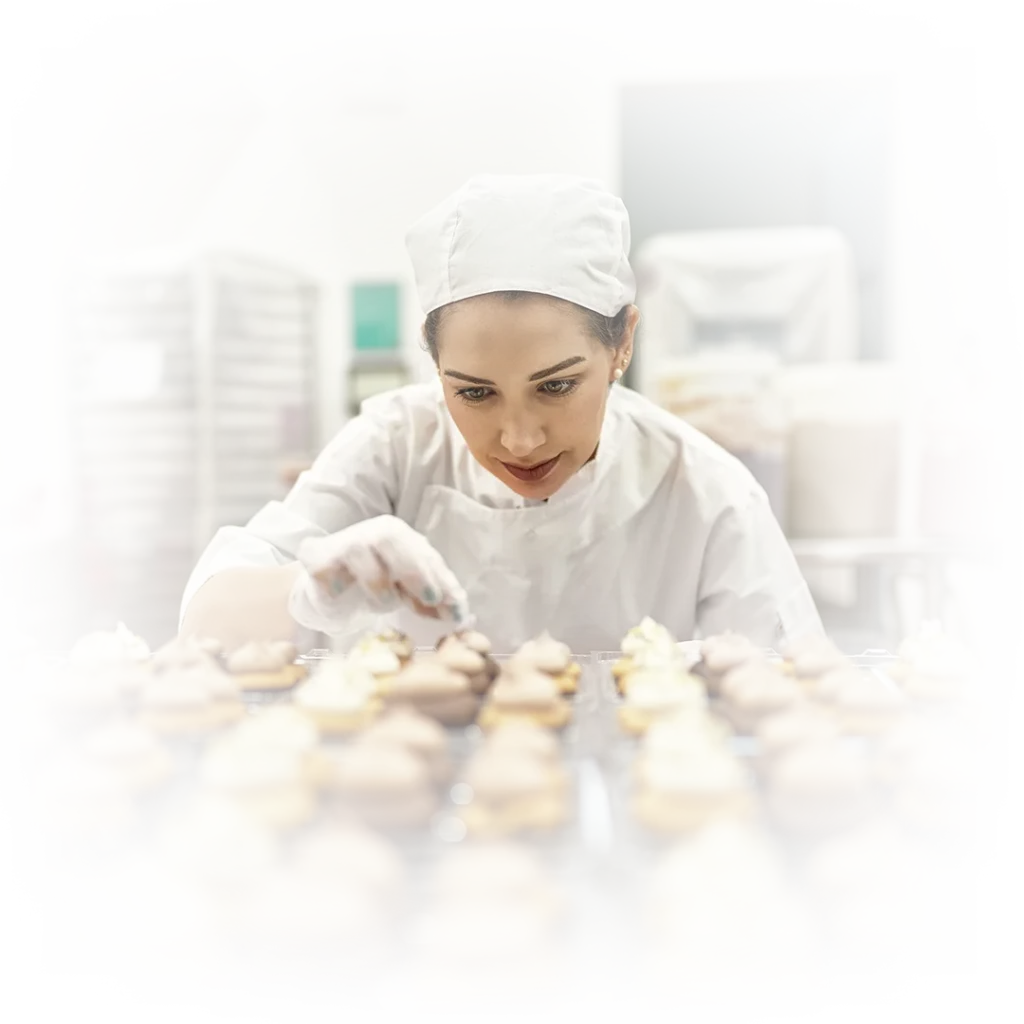 Baker working on cupcakes